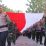 TNI- POLRI MENGGELAR KIRAB BENDERA MERAH PUTIH DI SEPANJANG JALAN 79 METER.